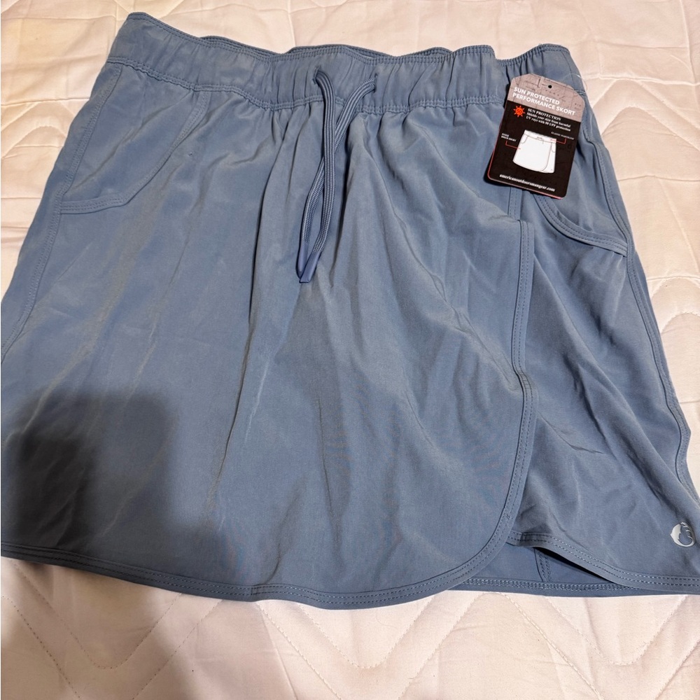 New with tags Dusty blue athletic skirt by the American outdoorsman size small
